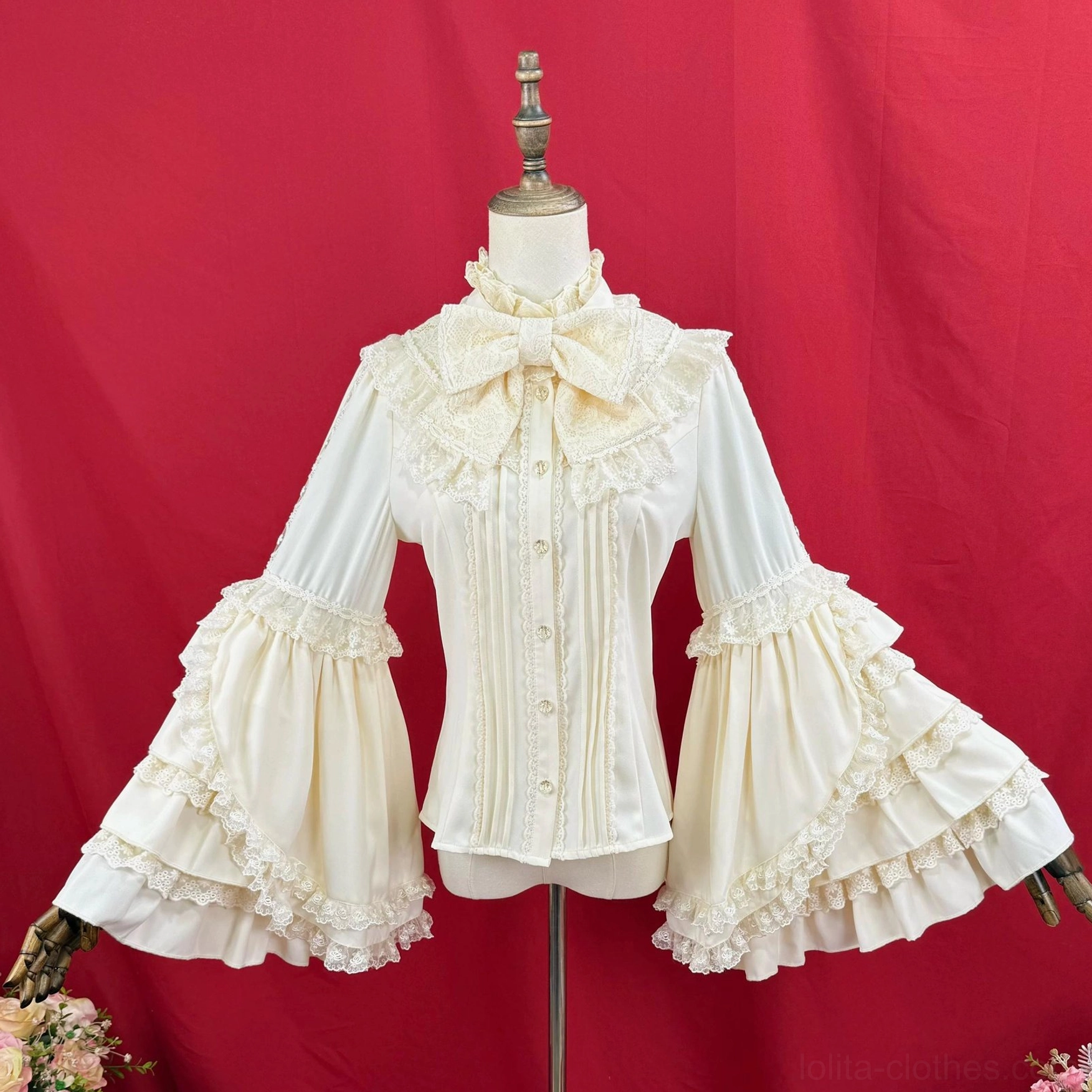 Classic Lolita bell sleeve blouse, cream white color, full front display showing bow neck decoration, fully extended ruffled bell sleeves with multiple layers