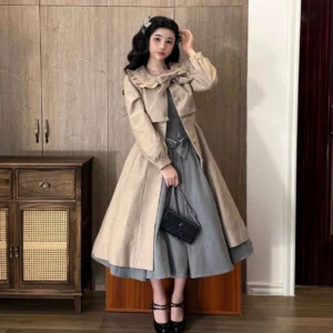 Full-body front view of elegant beige winter classic lolita woolen coat suit with grey A-line dress, vintage-inspired Peter Pan collar bow, and coordinating black heels in indoor wooden furniture setting