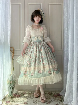 Classic Lolita two-piece dress set featuring lace-trimmed blouse and floral printed skirt with lace hair band and vintage indoor setting