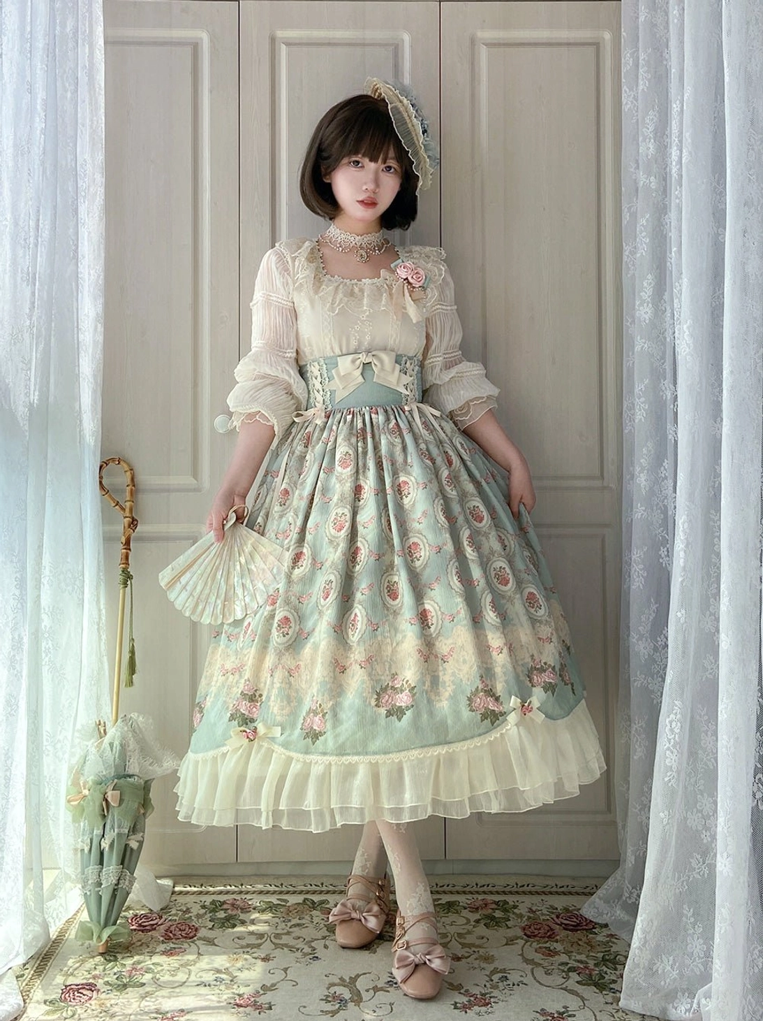 Classic Lolita two-piece dress set featuring lace-trimmed blouse and floral printed skirt with lace hair band and vintage indoor setting