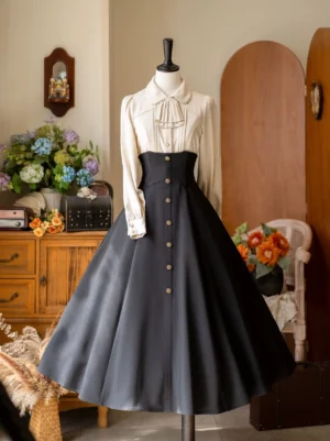 Front full-body view of black classic Lolita A-line skirt with fishbone boning paired with vintage Peter Pan collar ruffled blouse and high-waisted silhouette mannequin display