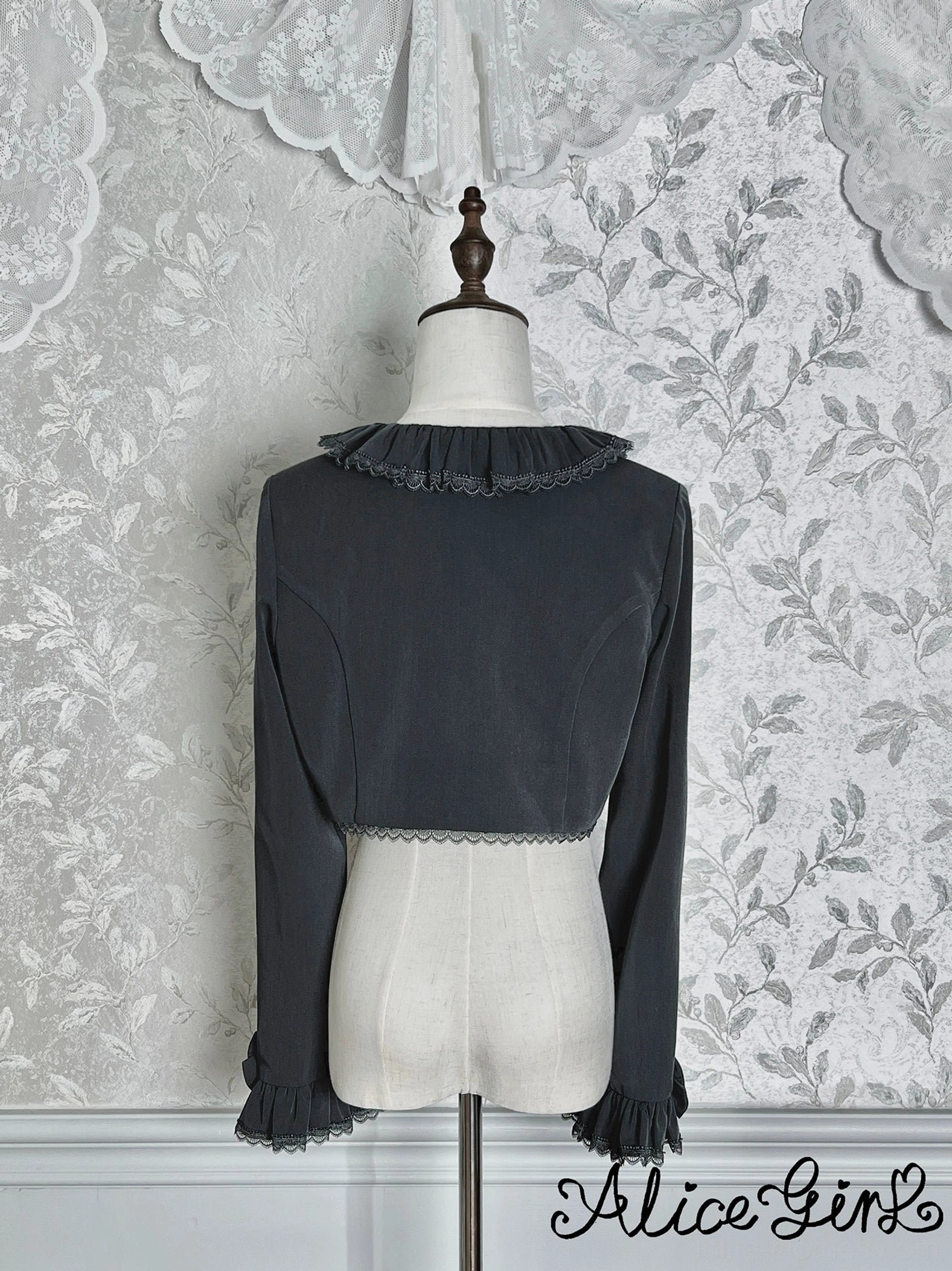 Dark gray classic lolita bolero back view showing lace collar trim and hem edge detail on mannequin