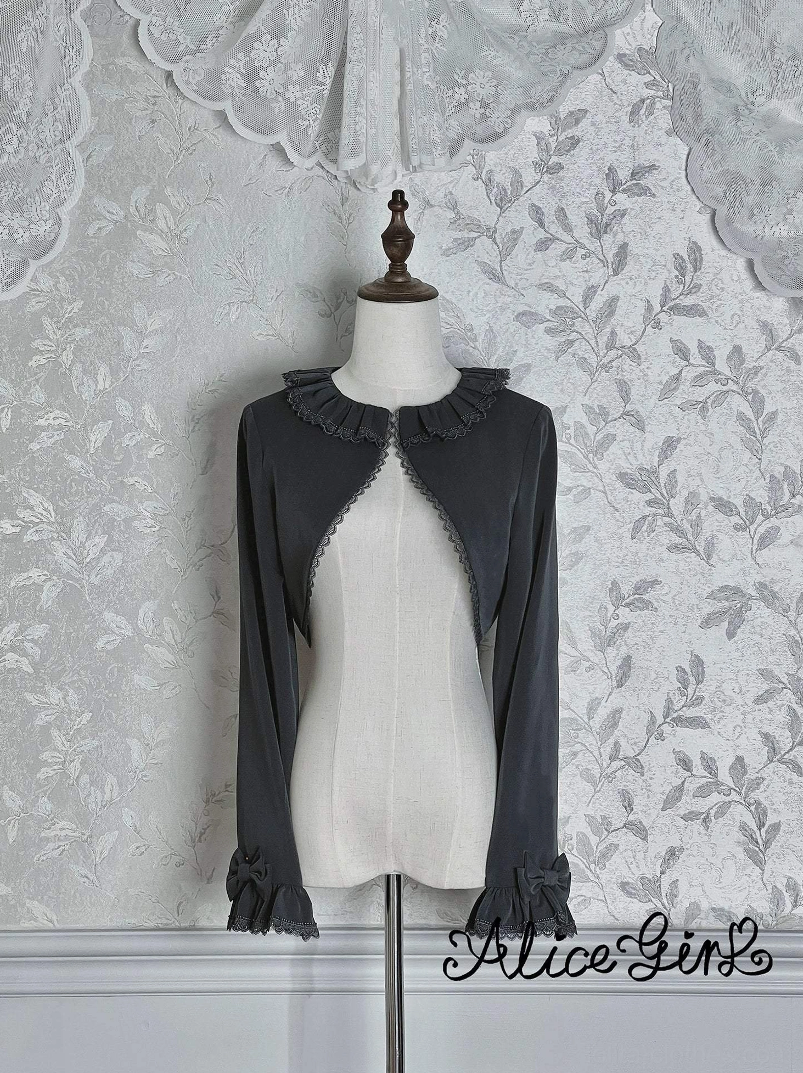 Dark gray classic lolita long-sleeve bolero front view on mannequin with scalloped lace trim collar and cuffs Victorian aesthetic