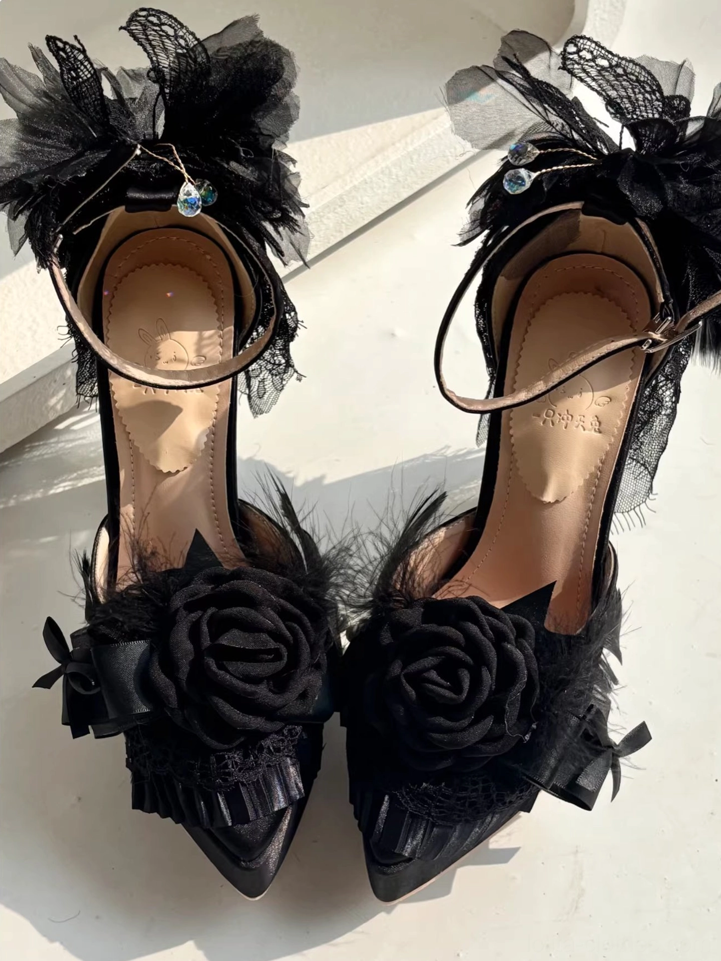 Classic lolita high heel shoes artisan craftsmanship showcase featuring hand-finished details, carefully secured feather decorations, quality construction techniques and precision