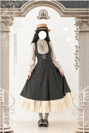 Classic Lolita JSK bust-support jumper skirt and long-sleeve waisted blouse set featuring black outer fabric with cream ruffled underskirt, front full-body view on model wearing fedora hat and platform loafers