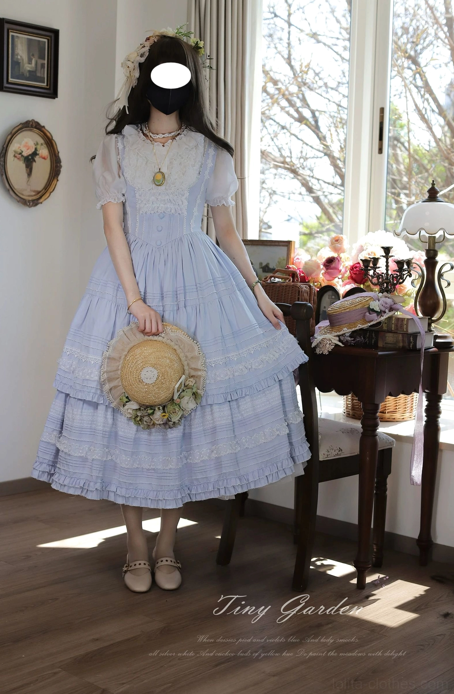 Light blue classic lolita bust-supporting JSK dress with delicate layered lace yoke worn with vintage straw hat and flower hair accessory - front full-body shot showcasing tiered ruffled midi skirt