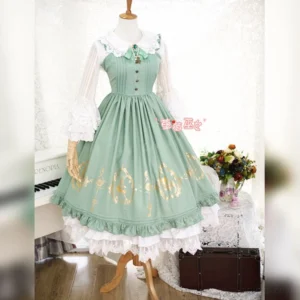 Mint green classic Lolita JSK dress with gold foil printing, pleated shoulder straps, and ruffled lace hem, displayed on mannequin with white ruffled blouse in vintage indoor setting