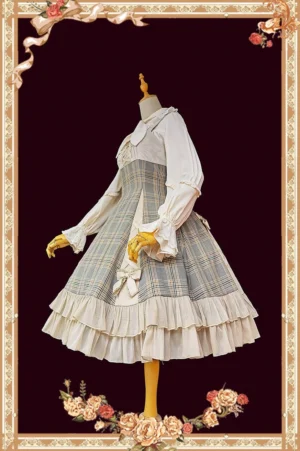 Side full-body profile of smoke grey plaid classic lolita jumper skirt dress featuring ruffled blouse cuffs, decorative waistline bows, and structured silhouette on vintage frame background