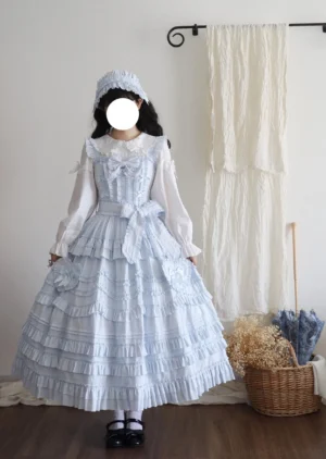Sky blue classic lolita JSK dress full-body front view with tiered ruffled hem, removable bow sash, and long-sleeve inner blouse - vintage-inspired alternative fashion jumper skirt