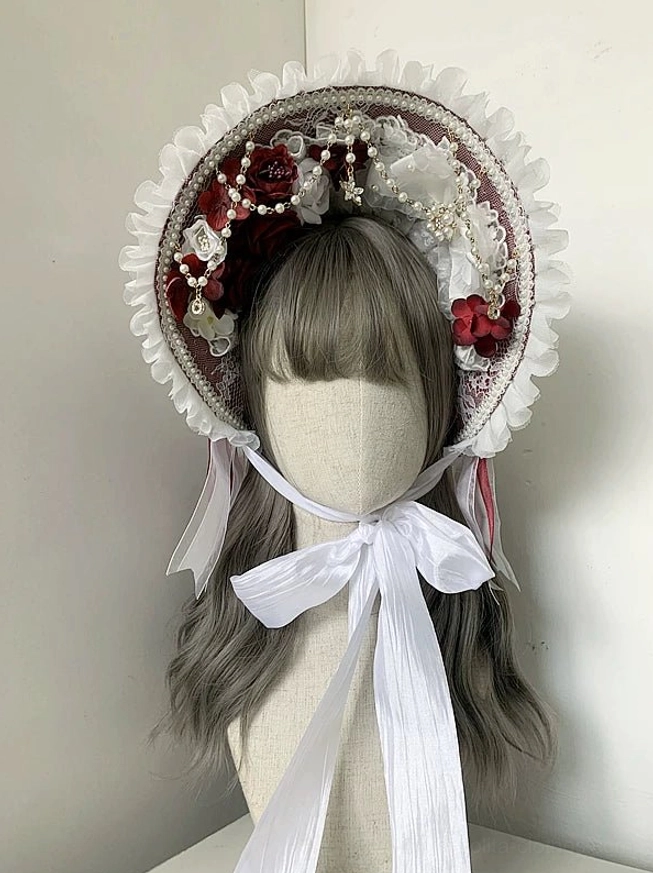 Classic lolita lace bonnet white ruffled trim red and white floral ornaments large white satin neck bow front view