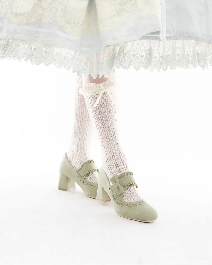 Classic lolita mary jane chunky heels with cutout vamp trim and decorative bow ankle strap, detailed close-up view showing suede texture and refined craftsmanship of the square-oval toe shape