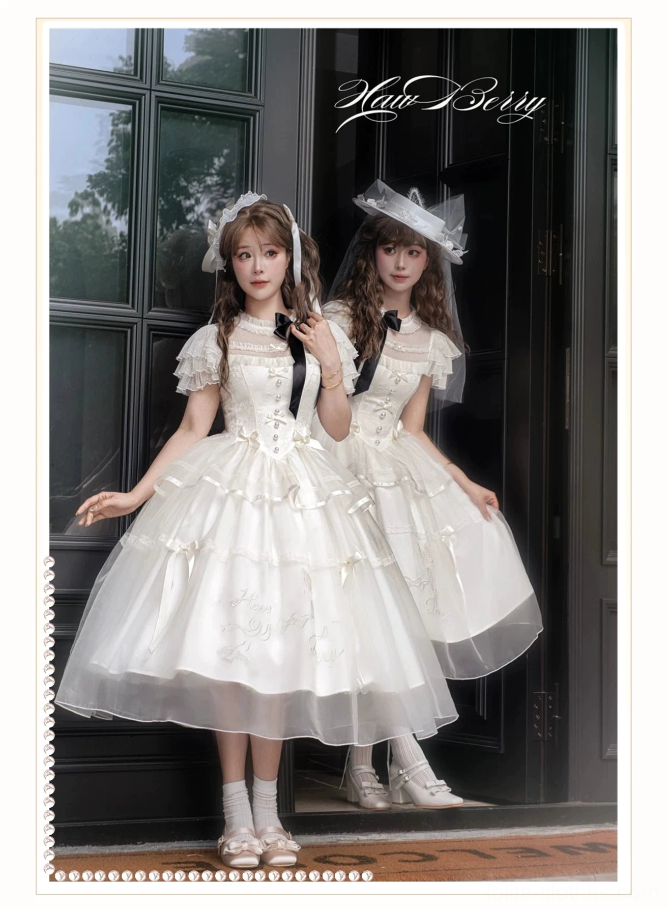 Two models wearing matching milky apricot classic lolita OP dresses with black bow details and tulle midi hems near vintage glass door with parasols and hair accessories