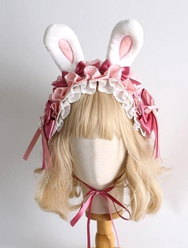 Classic lolita rabbit ear hair headdress front three-quarter view blonde mannequin fluffy white bunny ears solid pink inner ears ruffled lace satin bows adjustable chin tie straps