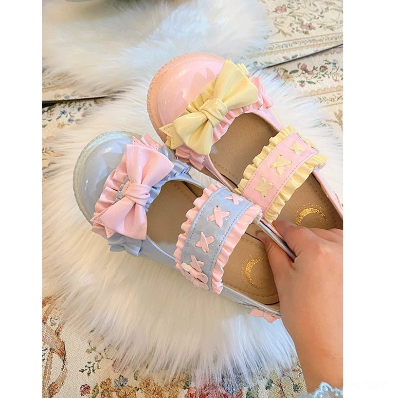 Lolita shoes paired with classic Lolita styling featuring structured JSK dress, refined cardigan and vintage-inspired accessories in jewel tone colors