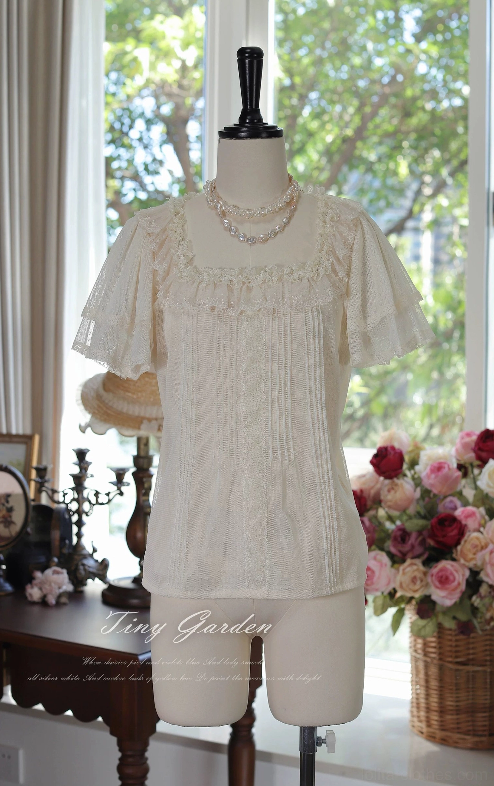Classic lolita square neck polka-dot tulle blouse front three-quarter angle showcase displaying cream beige color with ruffled flutter short sleeves, delicate lace trim neckline and vertical pintuck pleats in vintage studio setting
