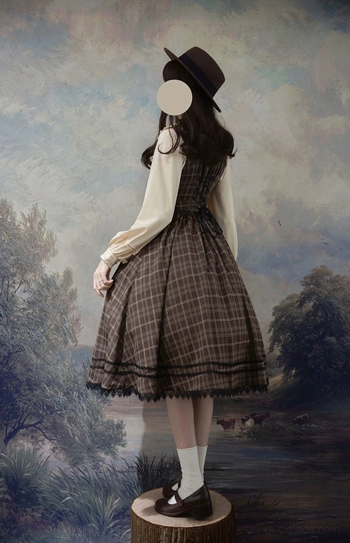 Back view of classic lolita tartan jumper dress with matching blouse model vintage styling tartan plaid lace-trimmed skirt hem matching coordinate
