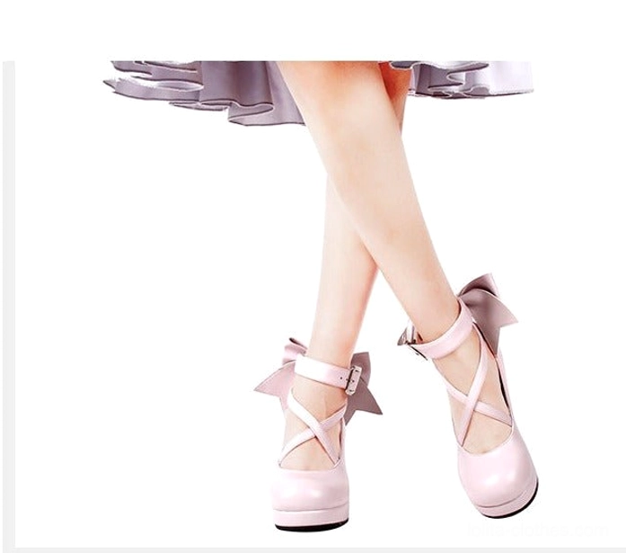 Classic navy blue Lolita platform heel shoes with matte finish, crossover ankle buckle straps, oversized decorative back bow, round platform toe, and block heel - main product view