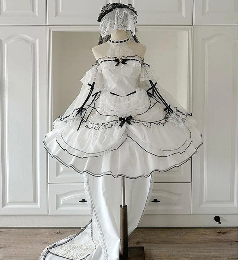 Model on grassland posing with black lace parasol wearing classic white and black sweet lolita dress with sleeveless halter bodice, pure tulle skirt and round lace hair bonnet