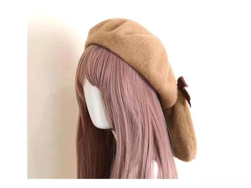 Close-up flat lay of brown plush rabbit ears with pink velvet inner lining and matching satin ribbon bows Lolita accessory