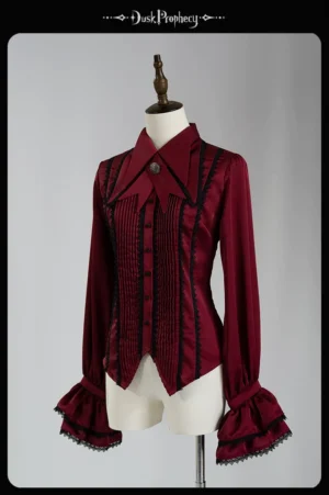 Coccyx tailored lolita blouse front three-quarter view red satin with black lace trim accordion pleats and bell sleeves detachable bow tie