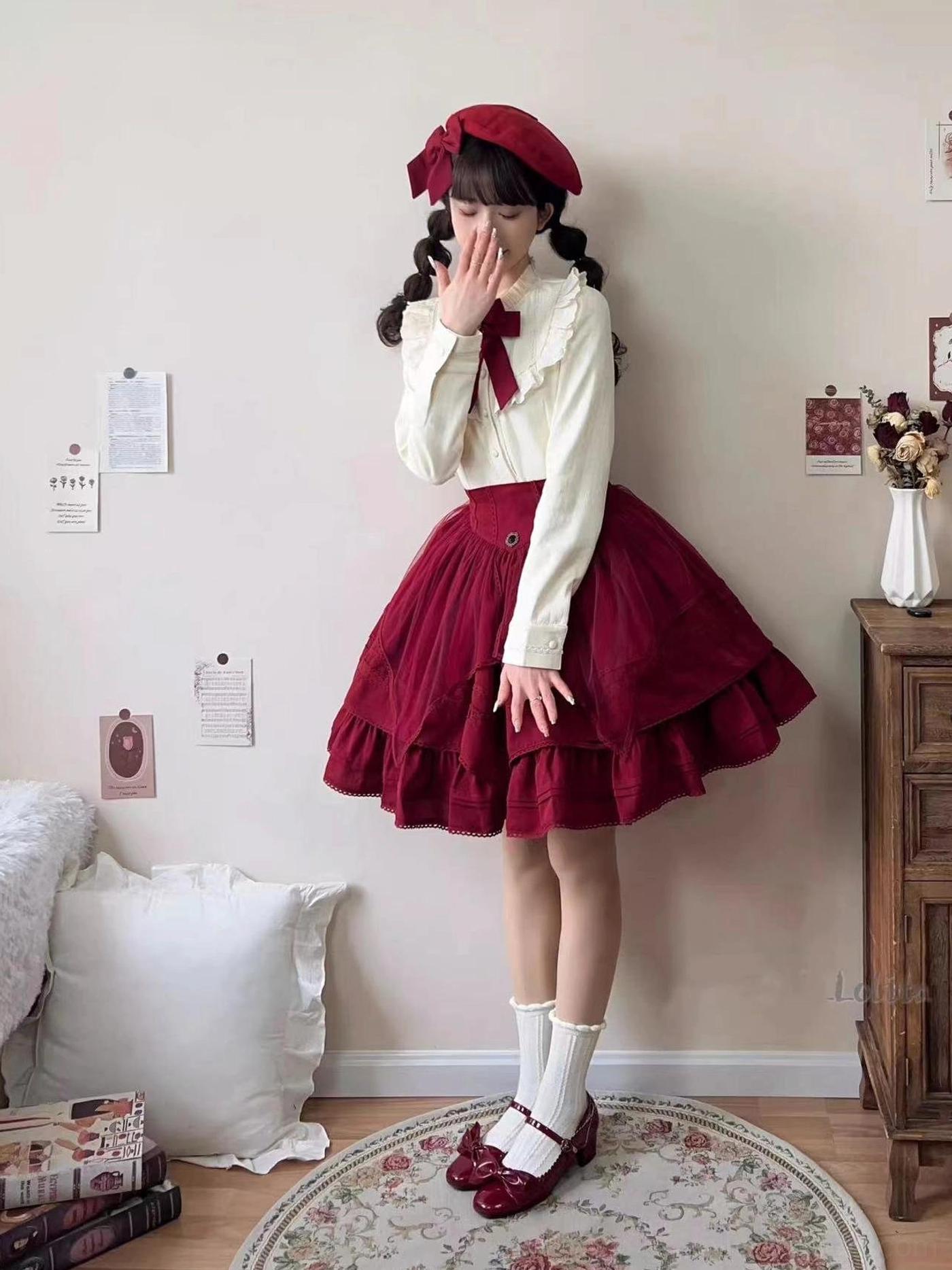 Full daily lolita outfit complete with cream fleece blouse paired with matching burgundy ruffled skirt red beret bow tie leather shoes model portrait vintage bedroom