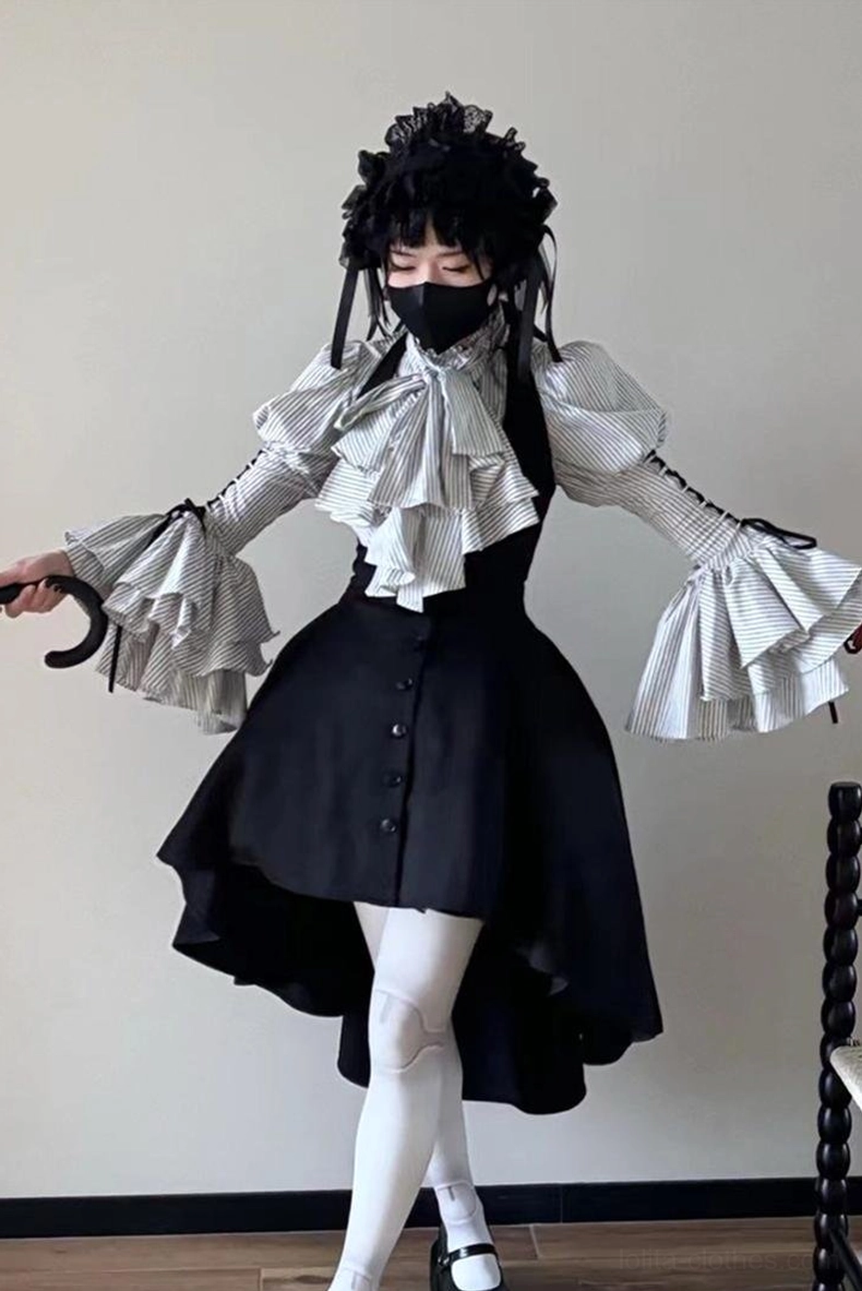 Complete Gothic Lolita outfit on model featuring ruffled bell cuff striped blouse, layered jabot, high-low black skirt, white stockings, Mary Jane shoes and gothic headpiece