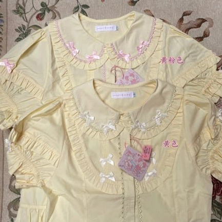 Condensed milk lolita blouse front button closure system with embroidered design and symmetrical placement detail photography