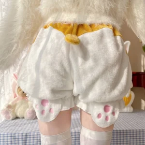 White corgi-tail velvet Lolita bloomers back close-up view showing plush corgi tail decoration and fluffy velvet texture with yellow waist trim accent