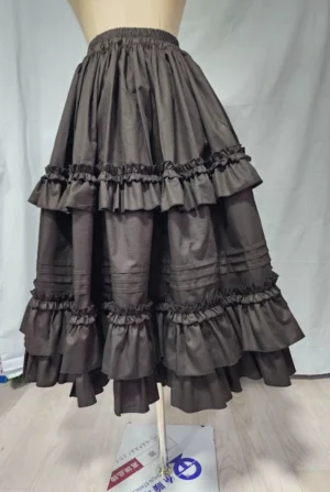 Front view of cotton Lolita petticoat with double ruffled hem displayed on dress mannequin, showing elastic waistband and A-line silhouette in dark gray