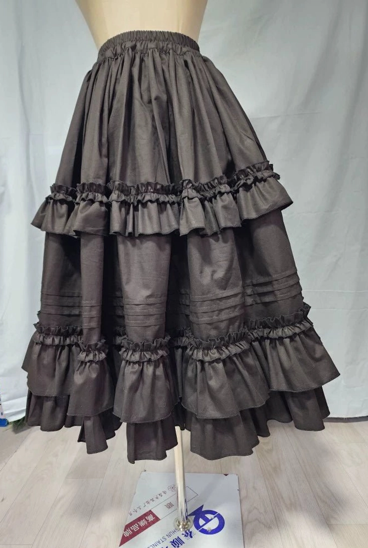 Front view of cotton Lolita petticoat with double ruffled hem displayed on dress mannequin, showing elastic waistband and A-line silhouette in dark gray