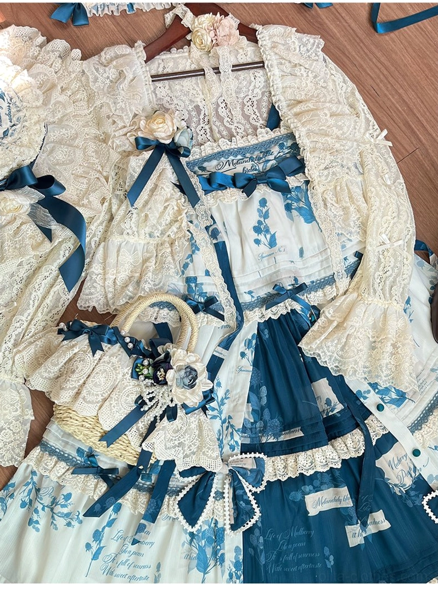 Model photograph in casual outdoor setting wearing complete country Lolita coordinate with dress, accessories, and headpiece for real-world styling reference