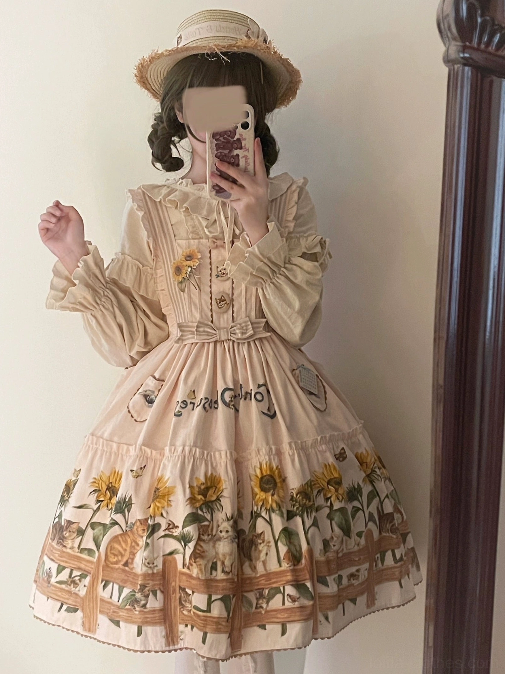 Back view of country lolita JSK dress showing tiered hem construction and internal shirring support