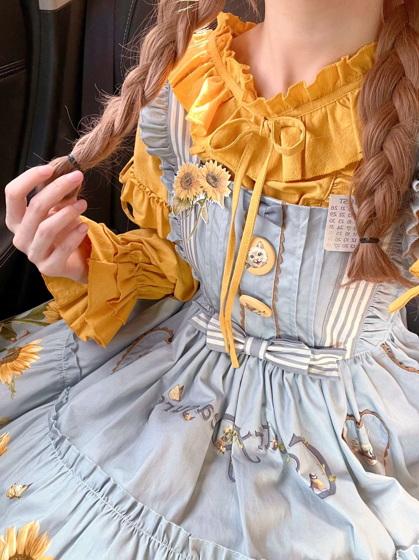 Detailed product view of cat motif print on country lolita jumper skirt showing design quality and craftsmanship