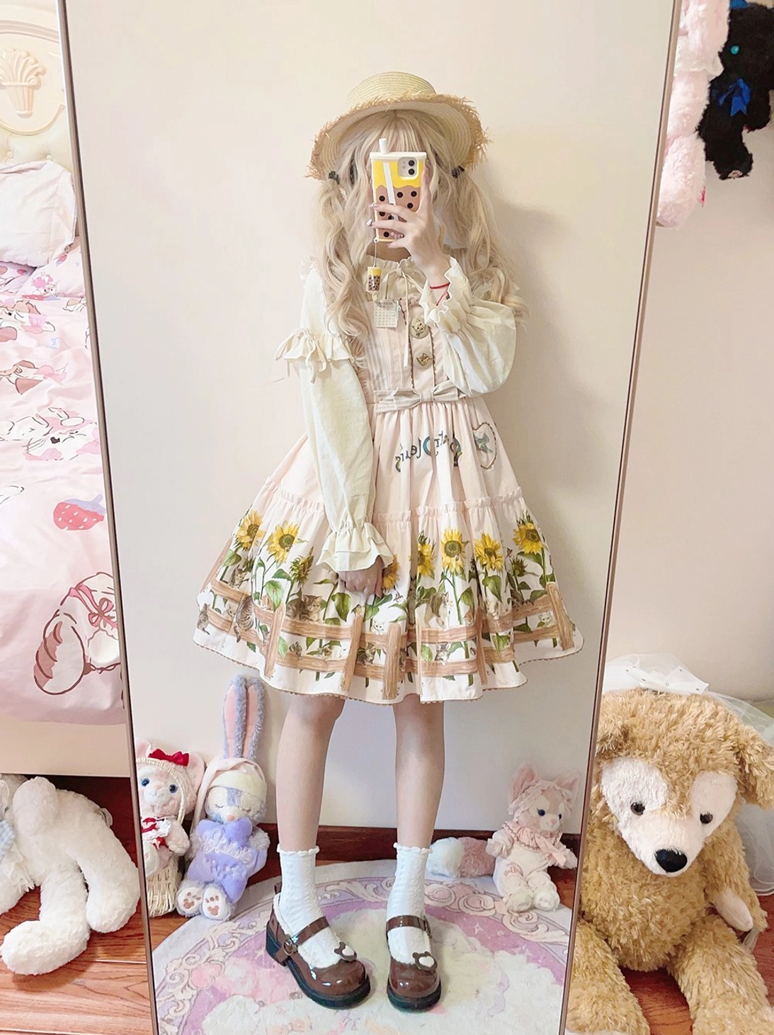 Country lolita dress styled with straw hat and seasonal accessories for outdoor wear