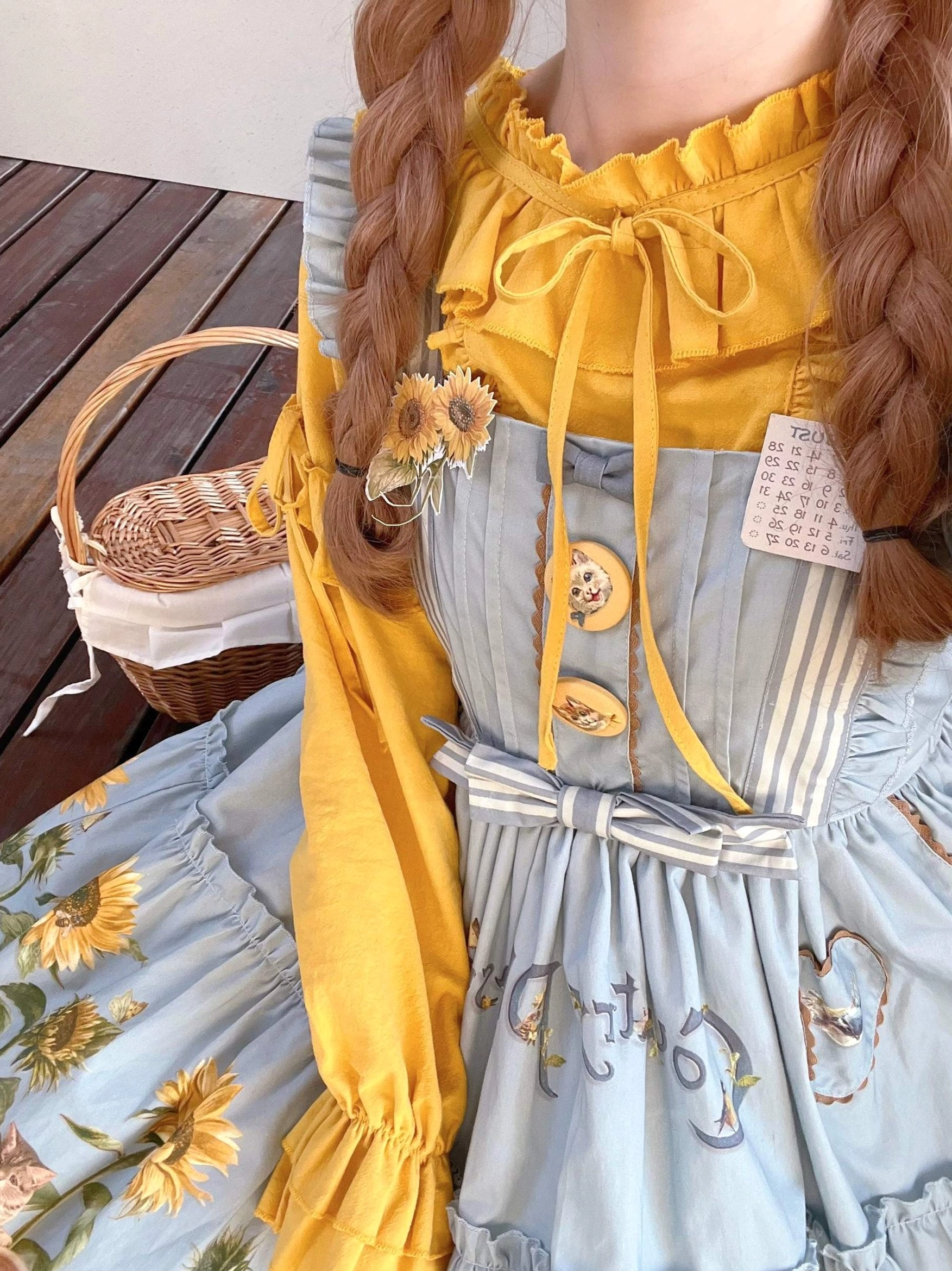Detailed close-up of country lolita JSK dress showing sunflower print design quality and fabric texture