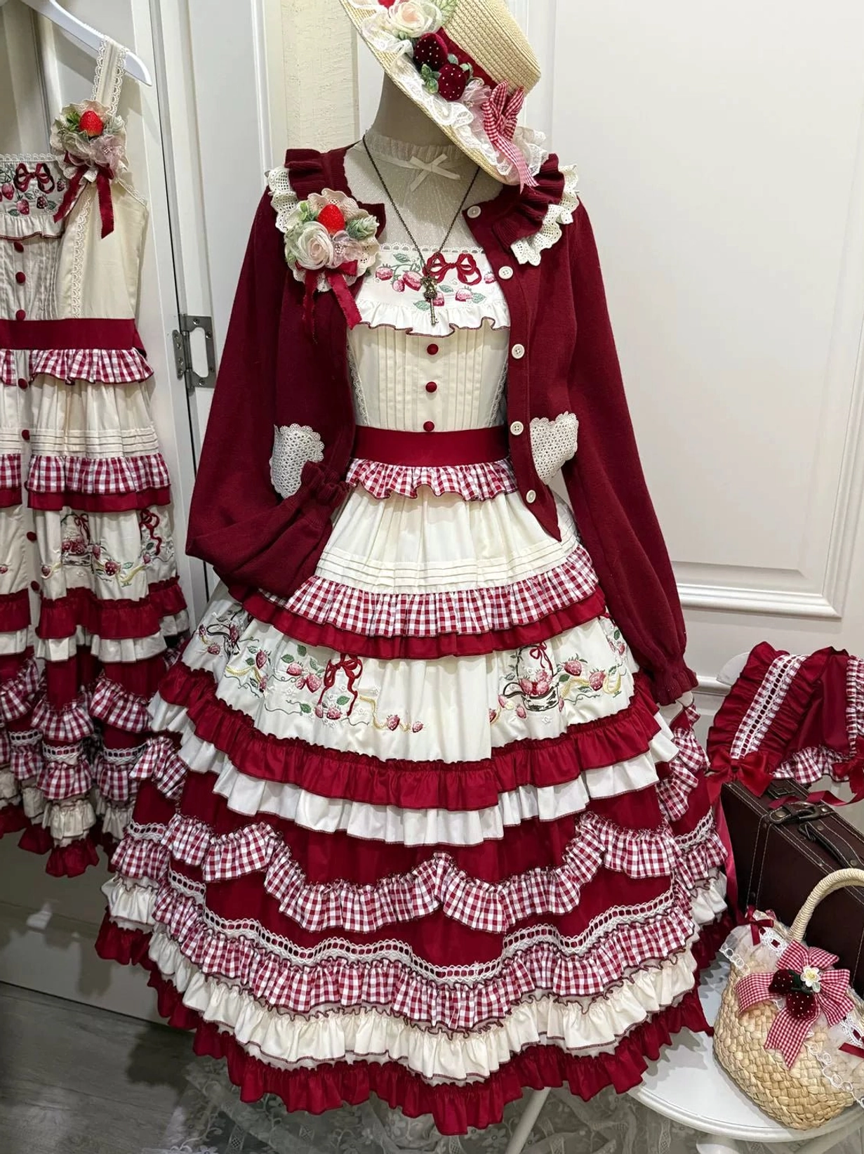 Complete country lolita coordinate with burgundy cardigan red gingham jumper skirt strawberry embroidery and matching accessories