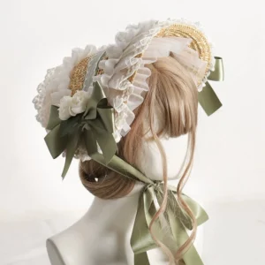 Country lolita straw bonnet with grass green satin bow and white ruffled lace trim featuring artificial white roses, rear three-quarter view on mannequin