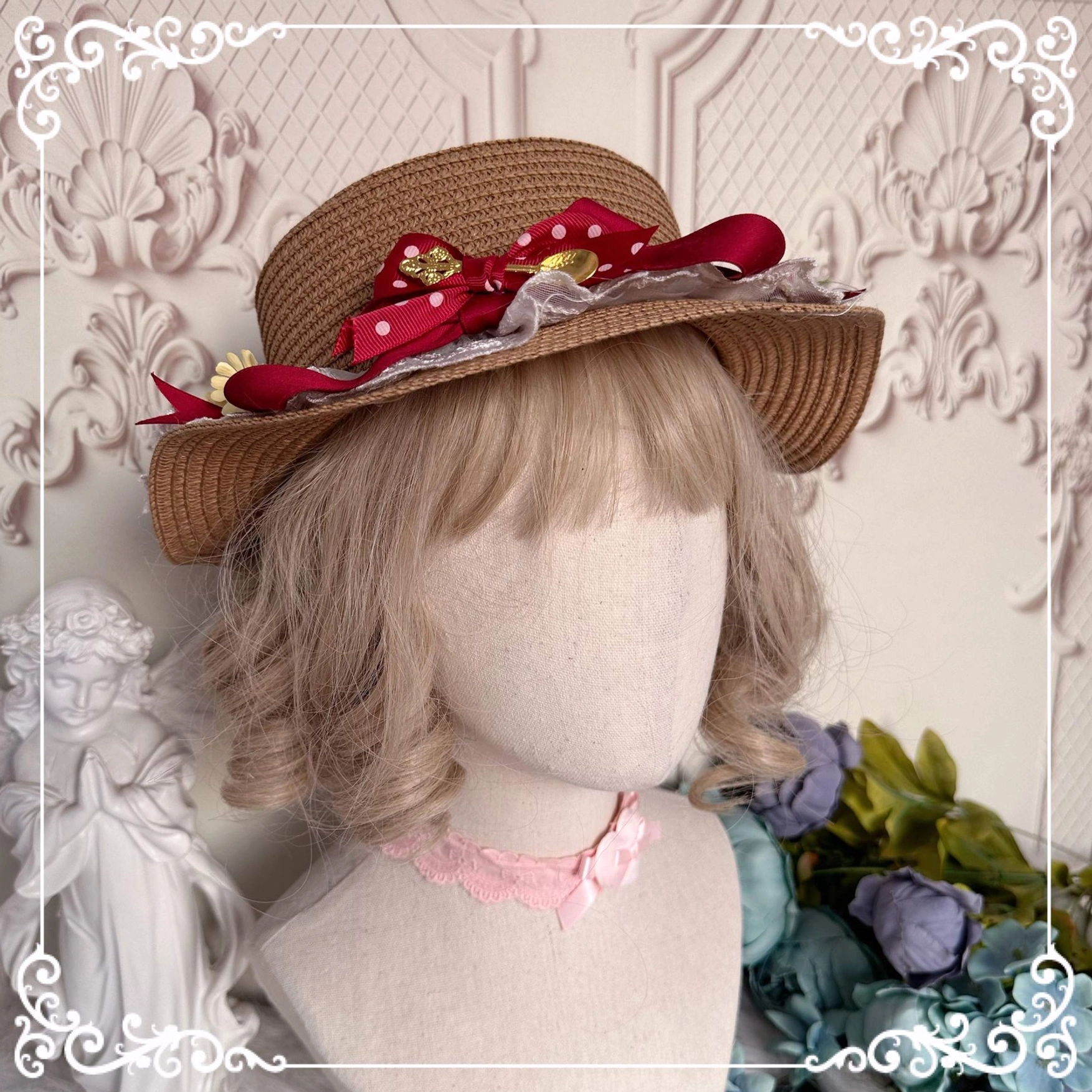 Light brown straw woven sun hat with wine red satin bows strawberry decorations and artificial flowers paired with pink choker