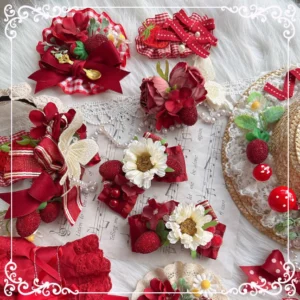 Country Lolita handmade strawberry hair accessories flat lay featuring wine red bows, daisies, and lace elements on sheet music background
