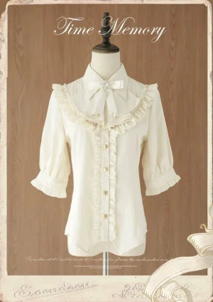 Cream beige classic lolita chiffon blouse with ruffled yoke and half puff sleeves front view on mannequin vintage wooden background
