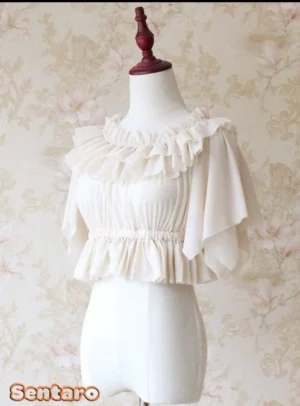 Cream beige lolita off-shoulder flutter sleeve chiffon blouse front view with ruffled neckline and elasticated waist on dress form vintage backdrop