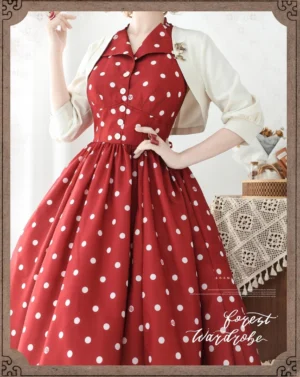 Cream bolero layered over red polka dot lolita dress with puffed three-quarter sleeves vintage tea party styling