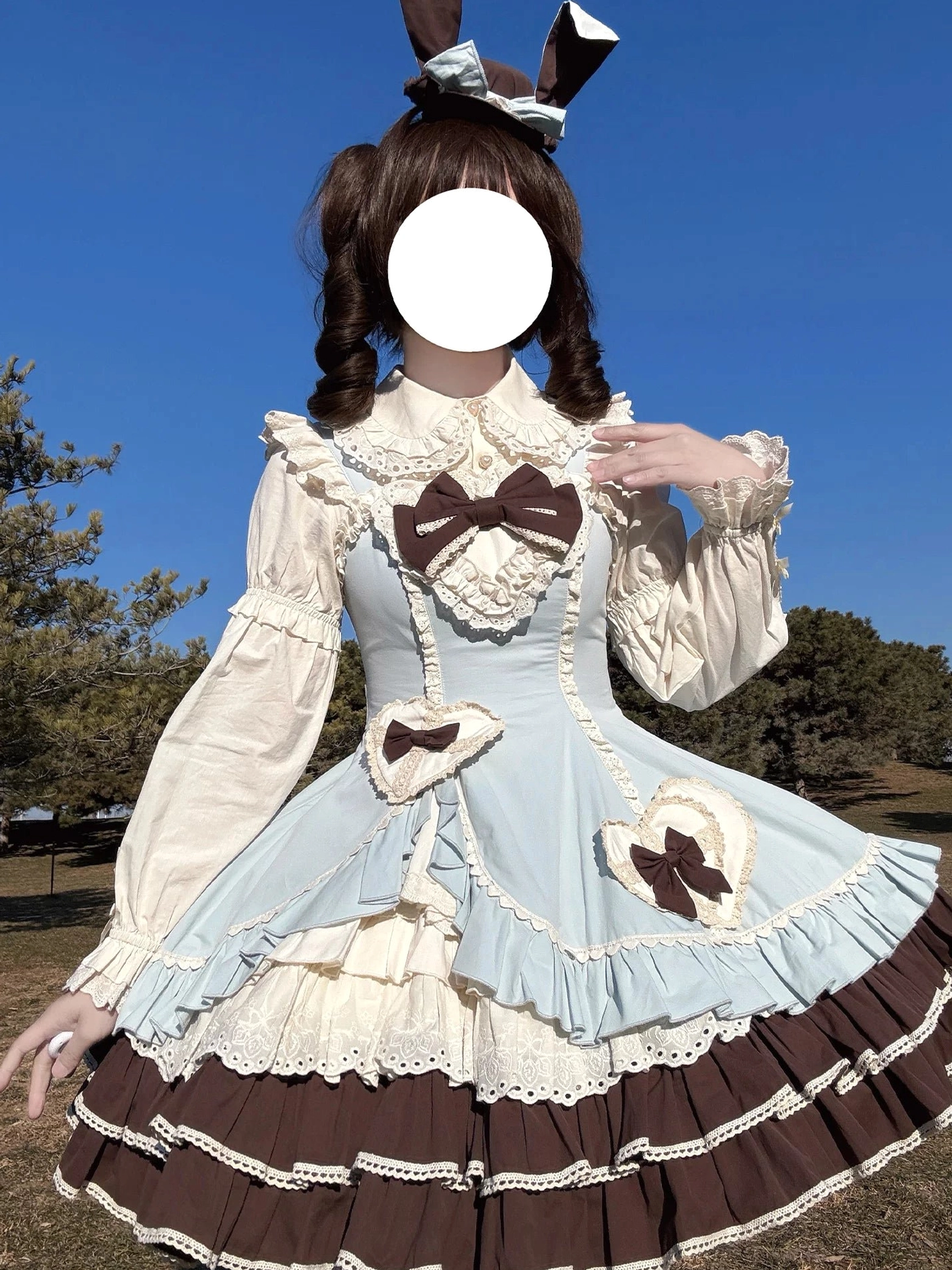 Cream Bud tiered hem lolita JSK black and white front three-quarter pose showing asymmetrical side opening design feature