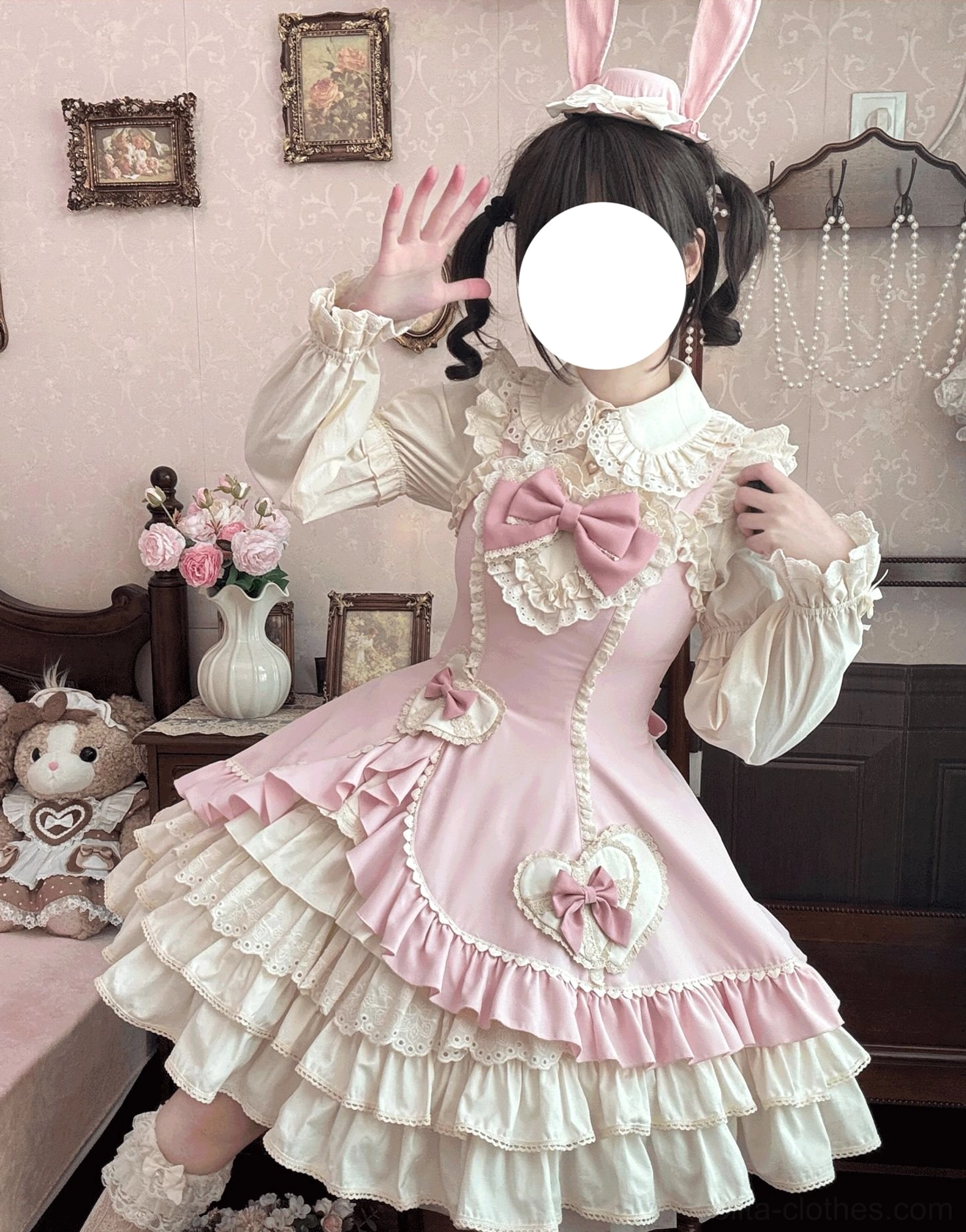 Cream Bud old school lolita JSK pink colorway front three-quarter dynamic indoor pose showing large bow frilled collar puffed sleeves