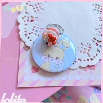 Cream cake lolita ring variant in pale cream and soft pastel colors with delicate miniature frosting details