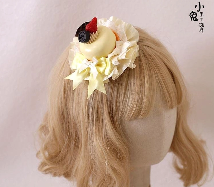 Cream dessert Lolita hairpin side back view on blonde mannequin showing pale yellow cream base strawberry black chocolate charm light yellow bows and lace frills