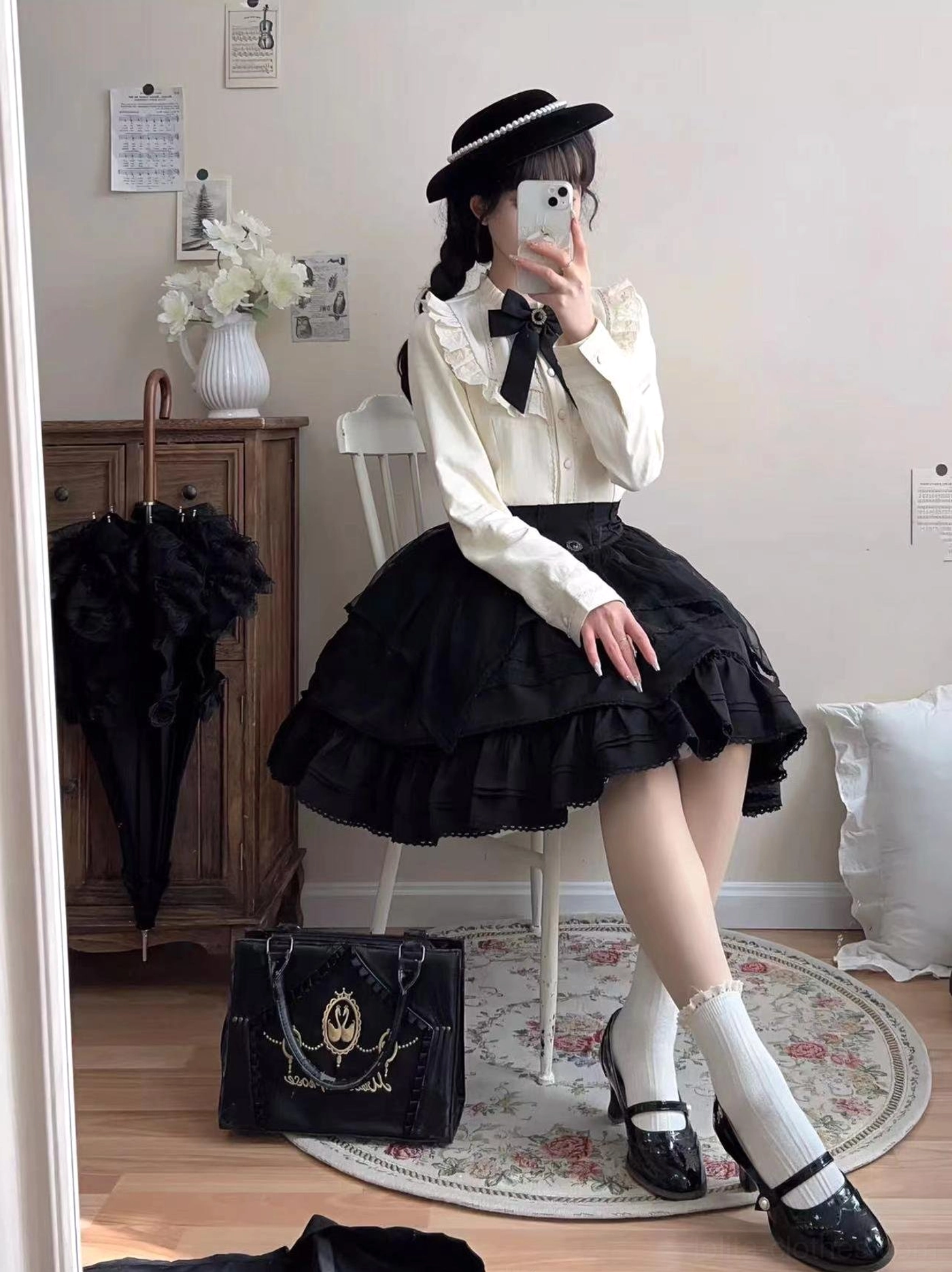 Cream fleece lolita blouse layered with black lace JSK jumper skirt demonstrating versatile styling gothic lolita aesthetic