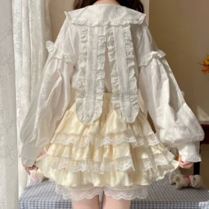 back view of cream tiered lace lolita short skirt with lace-decorated back blouse and extra lace lining at skirt hem