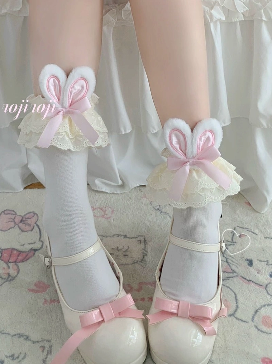 Cream lace pink bunny ear lolita socks front close-up with white Mary Jane shoes pink bow plush bunny ear cream ruffled lace cuff detail