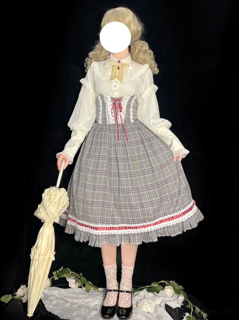 Cream Lolita bishop sleeve blouse with red lace-up plaid skirt and vintage umbrella prop on doll model